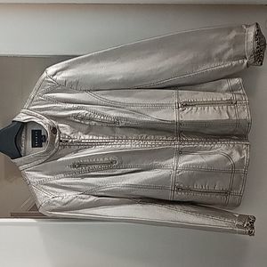 Tribal silver jacket with leopard lining. Multiple zippers on jacket. Size 12